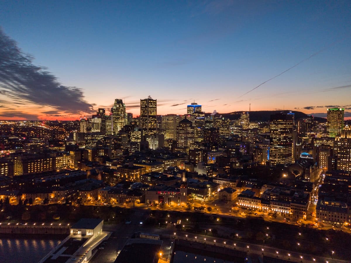 Montreal cityscape with colorful row houses and tree-lined streets